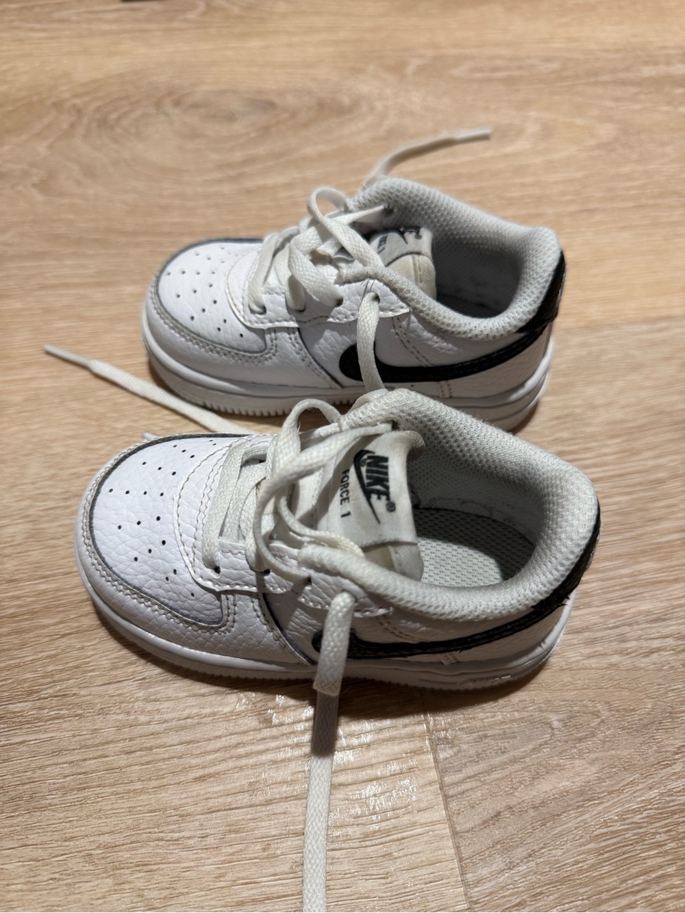 Nike Kids White Sneakers with Black Swoosh